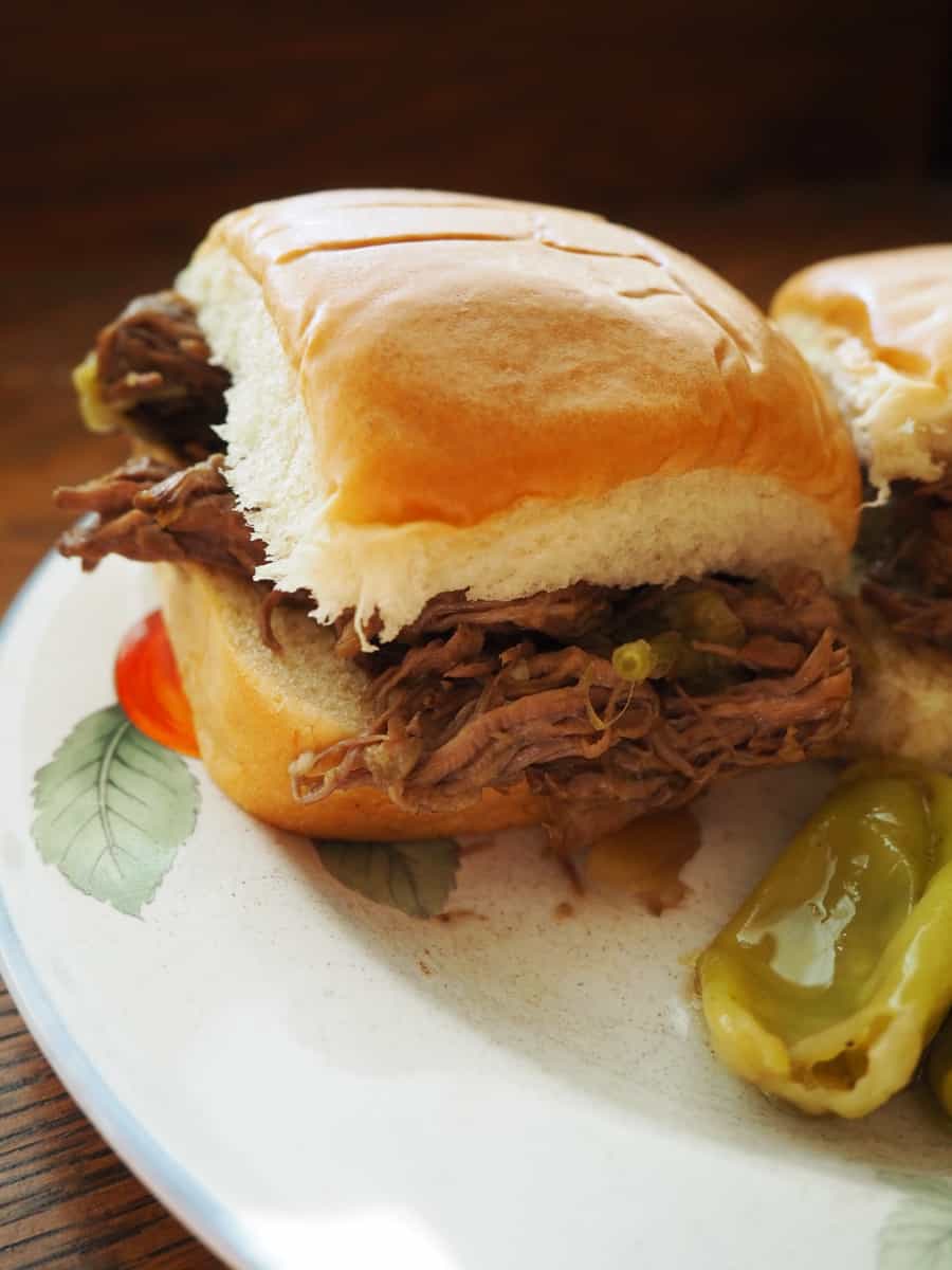 slow cooker beef peppercini sliders: I put this on before I went to bed and my house smelled wonderful when I woke up!! I shredded the meat to put them on sliders. This was a childhood favorite and a big hit with my family! | via Autumn All Along