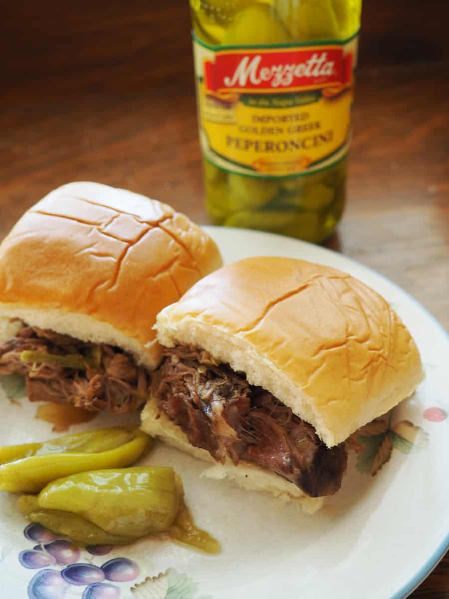 slow cooker beef peppercini sliders: I put this on before I went to bed and my house smelled wonderful when I woke up!! I shredded the meat to put them on sliders. This was a childhood favorite and a big hit with my family! | via Autumn All Along