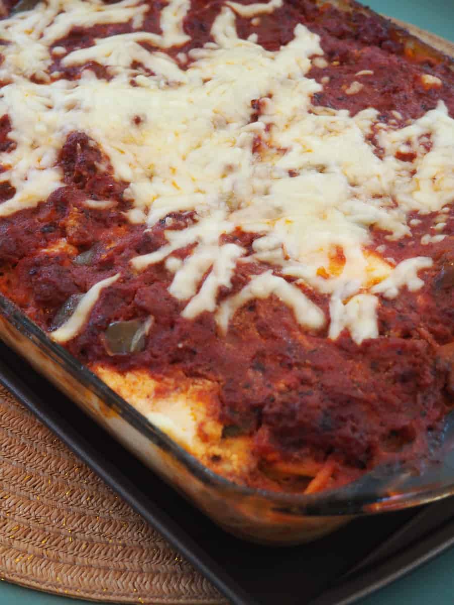 Try this delicious spaghetti bake recipe! It is easy to make, rich, and sure to become a family favorite. | via The Spirited Violet