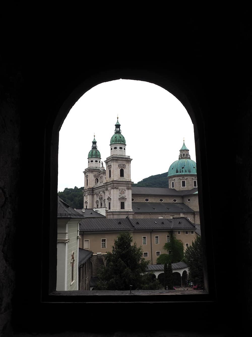 This is the view from St. Peters Abbey from Petersfriedhof, a medieval catacomb. Both can be visited in Salzburg, Austria. | via Autumn All Along 